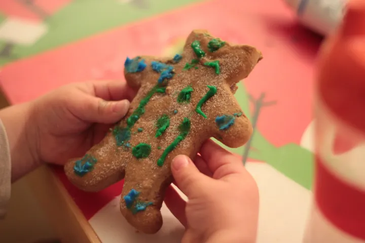 Grayson with gingerbread man (Photo Credit: Oleg • CC BY 2.0)